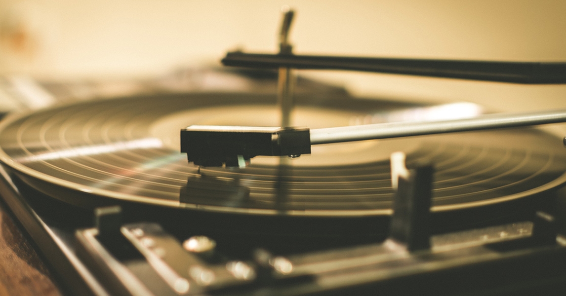 A close-up of a record player with a record rotating
