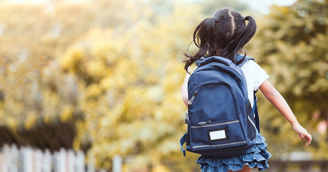 child with backpack