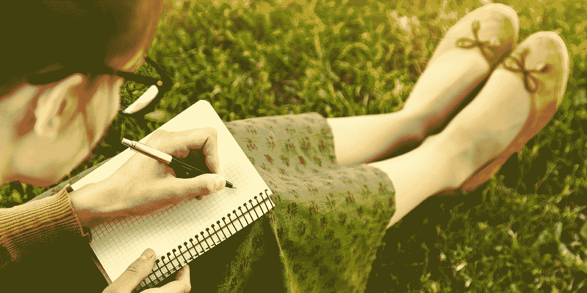woman-in-green-skirt-on-lawn-writing-in-a5-ring-bound-lined-book_flipped.gif