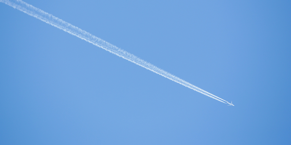 Airplane in blue sky 