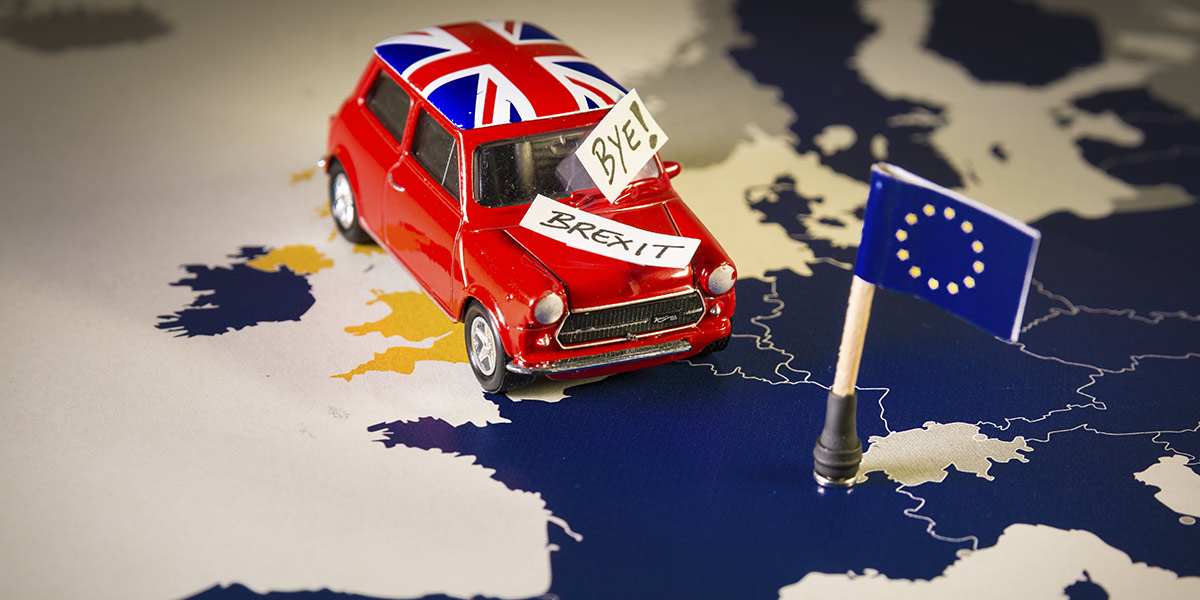 red-vintage-car-with-union-jack-flag-and-brexit-or-bye-words-over-an-ue-map-and-flag.jpg