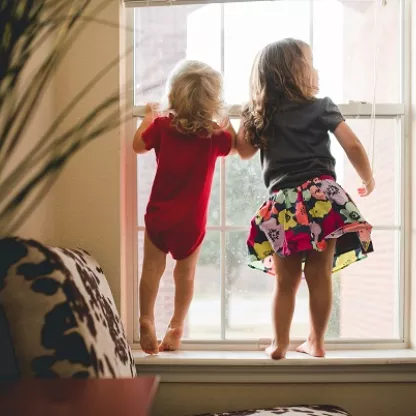 Kids playing by window
