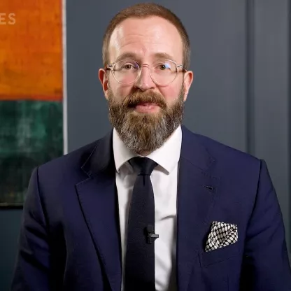 screengrab of Ed Smith wearing smart suit from video Investment Update thumbnail